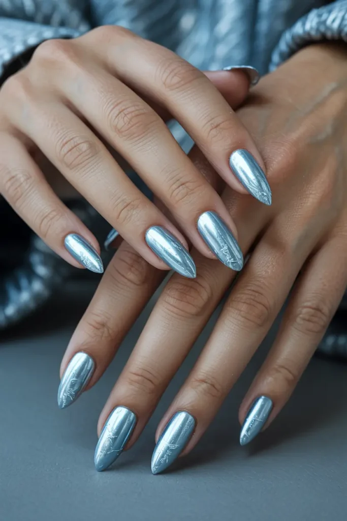 1. Icy Blue Chrome Winter Nails
